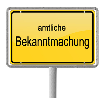 Das Foto zeigt ein gelbes Ortseingangsschild. Darauf steht: Amtliche Bekanntmachungen.